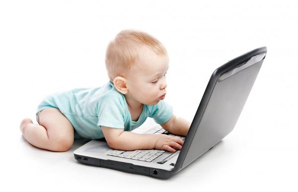 Baby Boy Blue Sleeper Playing on Laptop